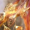 Nuevo cross-border led hierro forjado gold leaf light string 3D hollow gold leaf string lights decoraciones de navidad luces flash string details Picture
